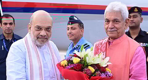 Union Home Minister Amit Shah being welcomed by Jammu and Kashmir Governor Manoj Sinha upon his arrival in Jammu. 