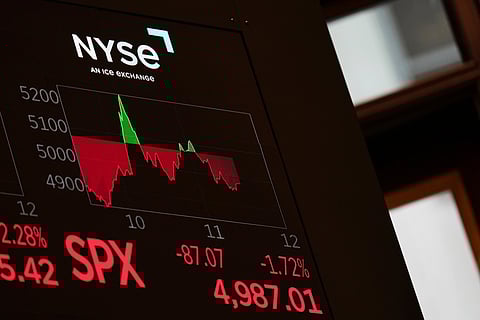 An electronic display shows financial information on the floor at the New York Stock Exchange in New York, Monday, April 7, 2025. 