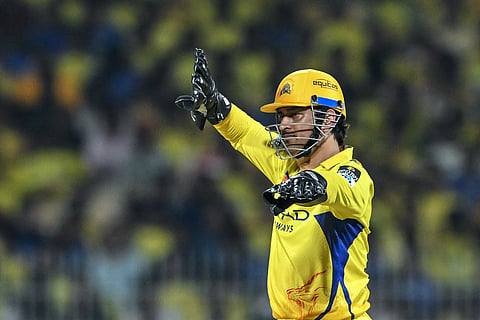 Chennai Super Kings' wicketkeeper MS Dhoni arranges the field during the IPL Twenty20 cricket match between CSK and Mumbai Indians at the MA Chidambaram Stadium in Chennai on March 23, 2025. 