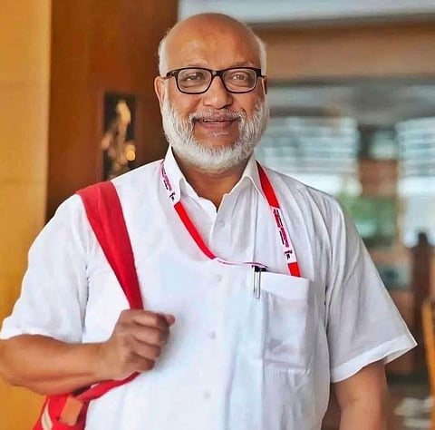 M A Baby, the newly elected general secretary of CPM, and politburo coordinator Prakash Karat raise hands during the 24th Party Congress in Madurai on Sunday.