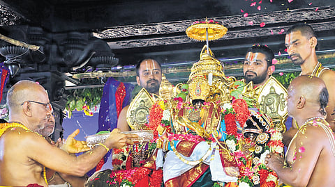 Priests perform puja during Pattabhishekam at Sita Ramachandra Swamy temple 
in Bhadrachalam on Monday.