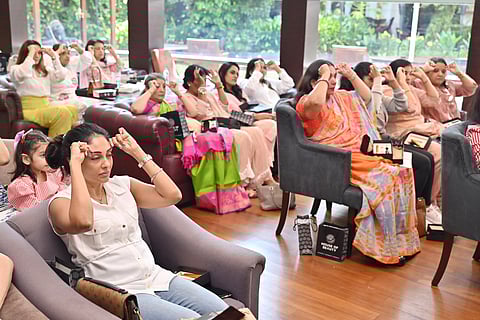 Participants at the face yoga session at The Wellness Party
