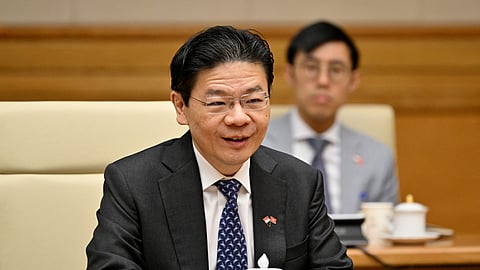 In this photo from March 26, 2025, Singapore Prime Minister Lawrence Wong takes part in a meeting in Hanoi, Vietnam.