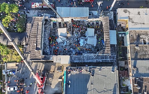 Rescue workers search for survivors at the Jet Set nightclub after its roof collapsed during a merengue concert in Santo Domingo, Dominican Republic, Tuesday, April 8, 2025.