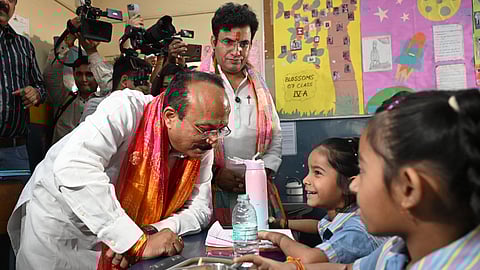 Delhi Education Minister Ashish Sood interacts with students during his visit to a Delhi government school for inspection in Patparganj Vidhan Sabha area, in New Delhi on Tuesday. Delhi MLA Ravindra Singh Negi also seen.
