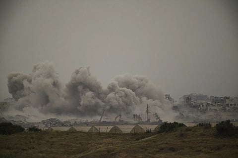 Smoke rises to the sky following an Israeli bombardment in the Gaza Strip as seen from southern Israel on Monday, April 7, 2025.