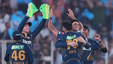 Gujarat Titans players celebrate a wicket during the IPL match against Rajasthan Royals