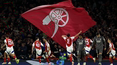 Arsenal's Spanish midfielder #23 Mikel Merino (centre right) celebrates scoring the team's third goal during the UEFA Champions League Quarter final first leg football match between Arsenal and Real Madrid, at the Emirates Stadium, in London, on April 8, 2025. 