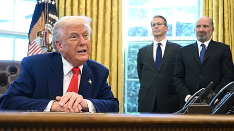 President Donald Trump speaks after signing an executive order in the Oval Office of the White House, Wednesday, April 9, 2025, in Washington, as Treasury Secretary Scott Bessent and Commerce Secretary Howard Lutnick listen.