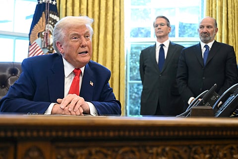 Chinese people visit an Apple Store, inside a shopping mall, in Beijing, Thursday, April 10, 2025. 