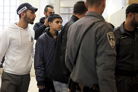 Ahmed Manasra, a 13-year-old Palestinian is brought to a court in Jerusalem, Tuesday Nov. 10, 2015. According to the indictment, Manasra and his cousin Hassan, 15, stabbed two Israelis in an east Jerusalem neighborhood.