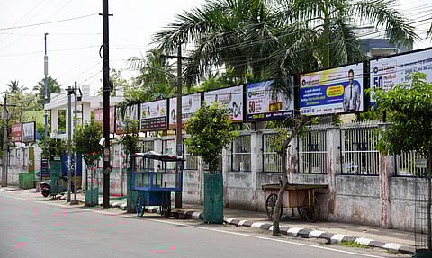 Advertisements on the compound wall of Tiruchy Corporations Anna Nagar Science Park in Tiruchy on Thursday.