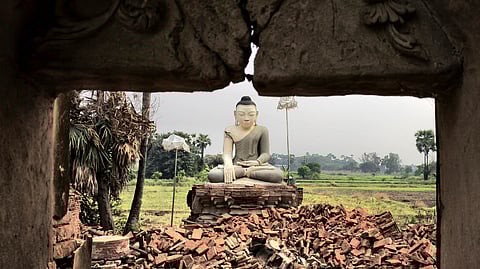 A Buddha statue is surrounded by debris in Inn Wa on the outskirts of Mandalay on April 6, 2025, following the devastating March 28 earthquake. The shallow 7.7-magnitude earthquake flattened buildings across Myanmar, killing more than 3,400 people and making thousands more homeless.
