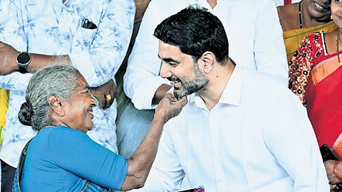 HRD Minister Lokesh distributes 1,030 house pattas to poor families.