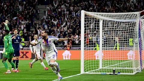 Lyon's French midfielder #18 Rayan Cherki (C) celebrates scoring his team's second goal during the UEFA Europa League Quarter final first leg football match between Olympique Lyonnais (OL) and Manchester United on April 10, 2025. 