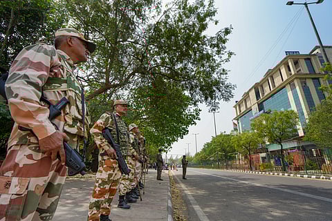Security personnel stand guard near the National Investigation Agency (NIA) headquarters in New Delhi where Rana is being grilled 