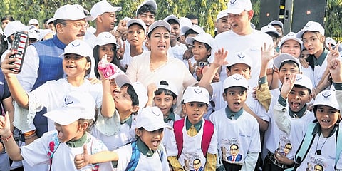 CM Rekha Gupta with school children during walkathon event at Vidhan Sabha on Sunday.