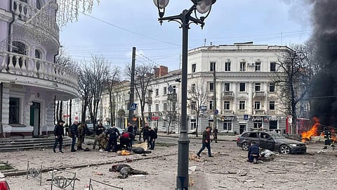 The bodies of the killed residents lie on the ground following a Russia's missile attack that killed at least 20 civilians in Sumy, Ukraine, Sunday, April 13, 2025.