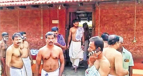 The group returns after offering prayers inside the nalambalam 