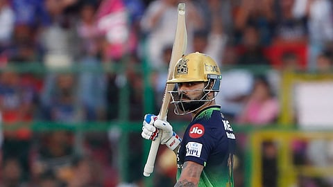 Royal Challengers Bengaluru's Virat Kohli celebrates his fifty runs during the Indian Premier League cricket match between Rajasthan Royals and Royal Challengers Bengaluru at Sawai Mansingh Stadium in Jaipur, India, Sunday, April 13, 2025.