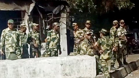 Security forces personnel guard in a violence-hit area of Jangipur, in Murshidabad district, Sunday, April 13, 2025. 