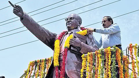 Chief Secretary, Special Chief Secretary (Energy) and Chairman and Managing Director of APTRANSCO K Vijayanand honouring a statue of Dr B R Ambedkar.