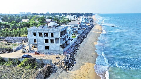 Illegal buildings along Old Karikattukuppam beach in Chengalpattu.