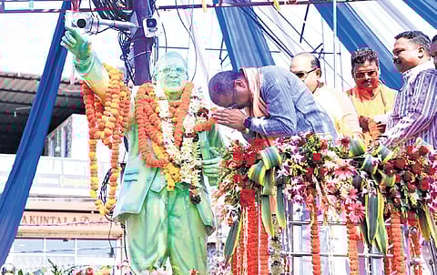 Pradhan paying tributes to Dr BR Ambedkar at Thelkopada on Monday.