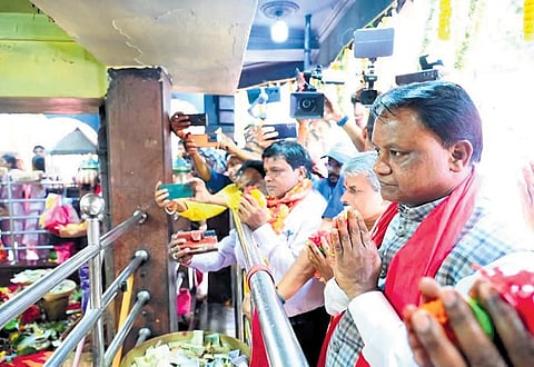 CM Mohan Charan Majhi offering prayer at the temple on Monday.