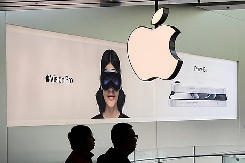Chinese people visit an Apple Store, inside a shopping mall, in Beijing, Thursday, April 10, 2025. 