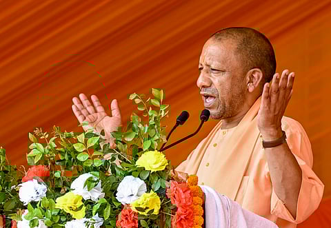 Uttar Pradesh Chief Minister Yogi Adityanath addresses a public meeting, in Varanasi, Friday, April 11, 2025.