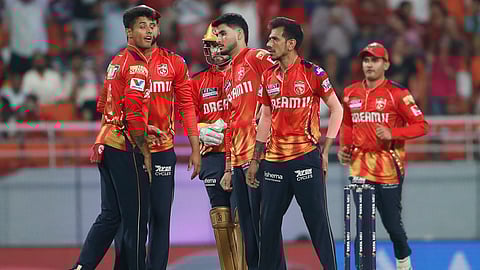 Punjab Kings' Yuzvendra Chahal, second right, celebrates with teammates after the dismissal of Kolkata Knight Riders captain Ajinkya Rahane (Photo | AP)