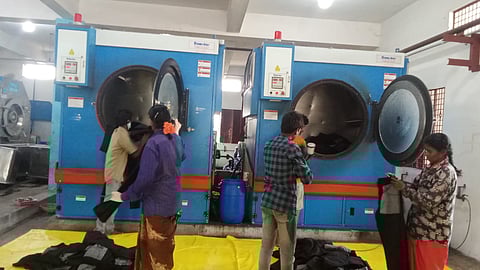 Workers washing jeans products at a washing unit in Ballari.