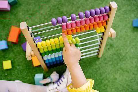 Representative picture of a child using an abacus. Those with Asperger's can have good arithmetic abilities