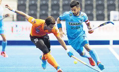 File picture of Manpreet Singh (R)