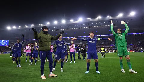 Paris Saint-Germain's French midfielder Desire Doue, Paris Saint-Germain's Brazilian defender #05 Marquinhos and Paris Saint-Germain's Italian goalkeeper #01 Gianluigi Donnarumma celebrate after the UEFA Champions League quarter-final second-leg football match between Aston Villa and Paris Saint-Germain at Villa Park in Birmingham, central England on April 15, 2025.