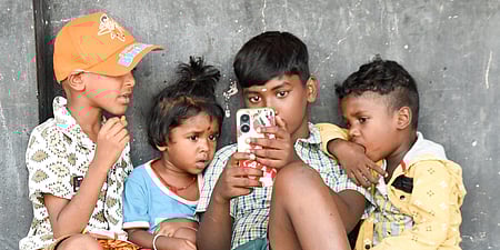 A set of childrens watching mobile phone image used for representation