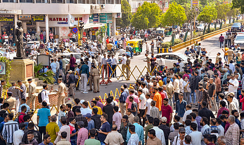 People protest after a city bus hit several vehicles, killing at least three and injuring many others, in Rajkot, Wednesday, April 16, 2025.