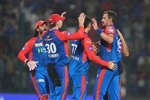 Delhi Capitals' Mitchell Starc, right, celebrates with teammates after the dismissal of Rajasthan Royals' Dhruv Jurel, leading to a Super Over (Photo | AP)