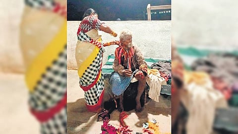 D Vanaja, the organiser of Annapoorna Charitable Trust Ashramam, is shaving a mentally disabled person at her shelter in Suryapet.