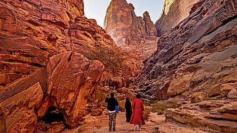 Tourits at the sandstone cliffs of Jabal Ikmah