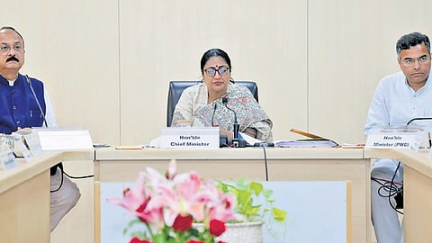 Delhi Chief Minister Rekha Gupta (C) with cabinet ministers Ashish Sood (L) and Parvesh Verma (R).