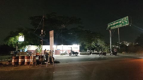 Due to dysfunctional street lights near Zuzuvadi prohibition police border check post in Krishnagiri to Bengaluru National Highway, police personnel risks life checking vehicle at night time.