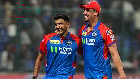 DC's Axar Patel and M Starc celebrate their win in the Indian Premier League 2025 cricket match against Rajasthan Royals (RR) at Arun Jaitley Stadium in New Delhi, Wednesday, April 16, 2025.