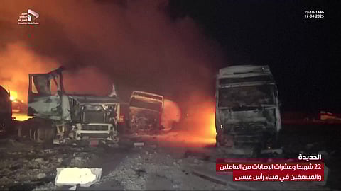 This grab taken from footage released by al-Masirah TV station of Yemen's Huthis shows fire and destruction at the site of US strikes on the Ras Issa fuel port in western Yemen on April 18, 2025.