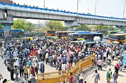 Locals stage a protest over the death of a 17-year-old youth in Seelampur.
