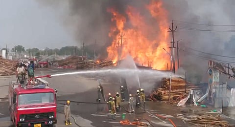 Firefighting continues at a tent house godown in Prayagraj, where a fire broke out early in the morning, April 19, 2025.