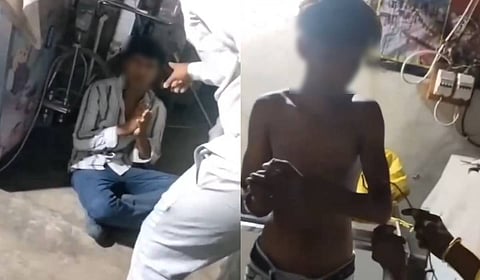 Videograb of the workers being tourtured; given electric shocks (R)