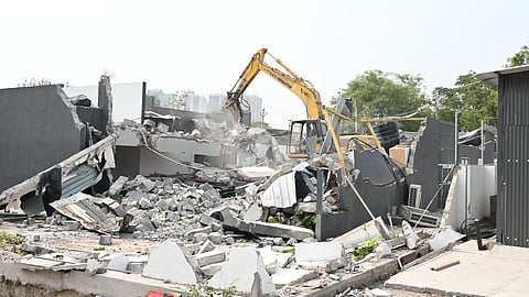 HYDRAA removed the compound walls and the structures inside and erected boards declaring the land as government land.