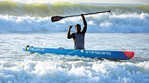 Sathish Kumar performs paddling; (inset) Sathish training the students of his SUP Marina club in Chennai.